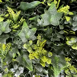 Artificial green wall panel with variegated greens and yellow foliage palms grasses ferns with yellow and white tipped foliage 100×100 cm