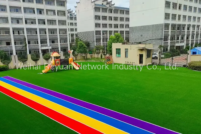 What are the advantages of laying artificial grass in kindergartens?